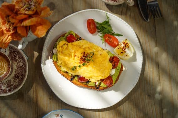 Creamy avocado toast with egg image