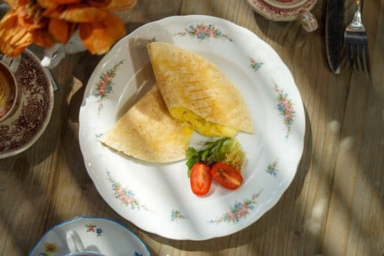 Cheesy egg tortilla image